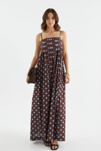 Load image into Gallery viewer, Brown polka dot maxi dress with model's face shown