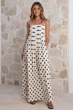 Load image into Gallery viewer, Cream polka dot maxi dress with model's face shown
