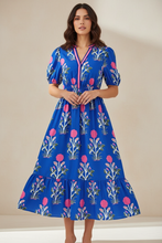 Load image into Gallery viewer, Blue floral dress styled on Hispanic woman
