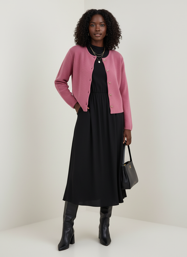 Pink cardigan with black midi dress