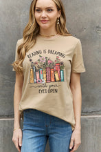 Load image into Gallery viewer, READING IS DREAMING WITH YOUR EYES OPEN Graphic Tee
